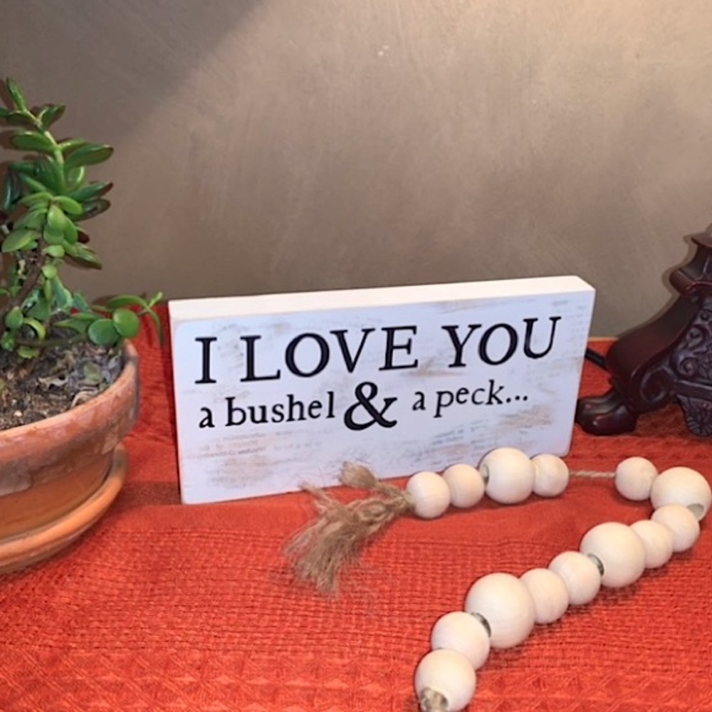 Wood sign with wood bead garland